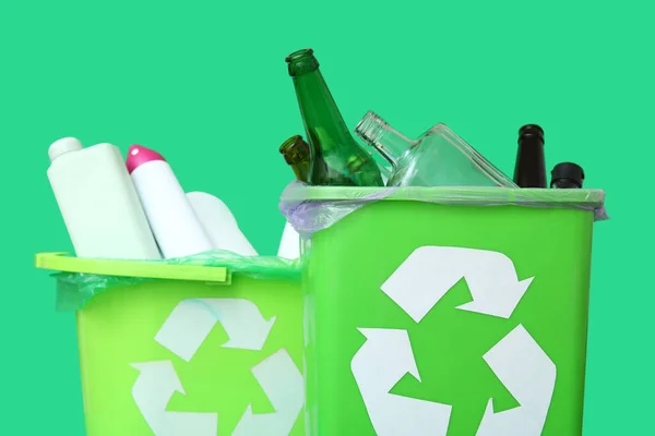 stock-photo-trash-bins-different-garbage-green-background-closeup